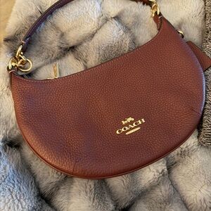 COACH Pebbled Leather Crescent Hobo Bag in deep burgundy